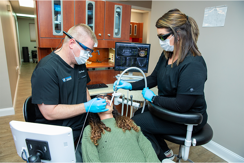 Doctor wright performing dental laser procedure