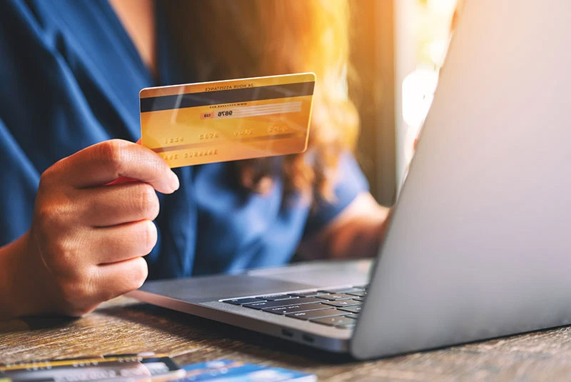 Dental Patient Paying For His Procedure With A Credit Card