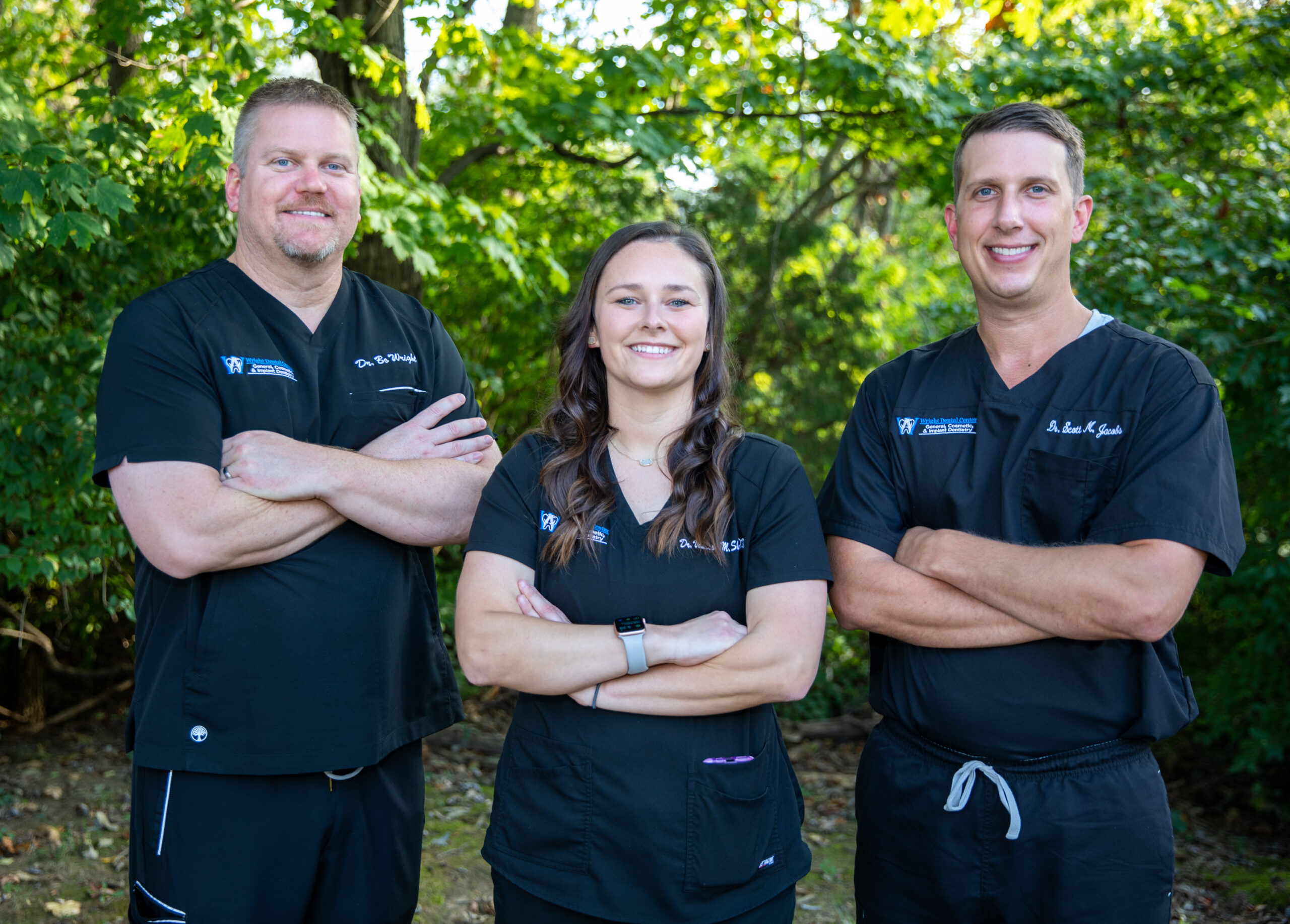 an image of thee doctors at wright dental center.